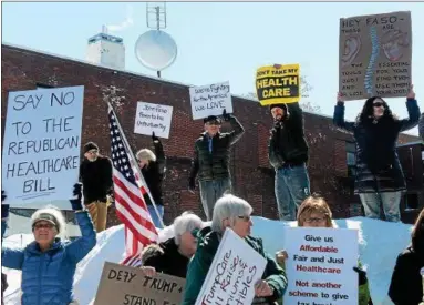  ?? TANIA BARRICKLO — DAILY FREEMAN ?? Upwards of 60 protestors came out for Faso on Friday in front of his headquarte­rs at Seven21 Media Center on Broadway in Midtown Kingston. The group, which is organized by the Hudson Valley chapter of Citizen Action, meets every Friday from 12 to 1 p.m.