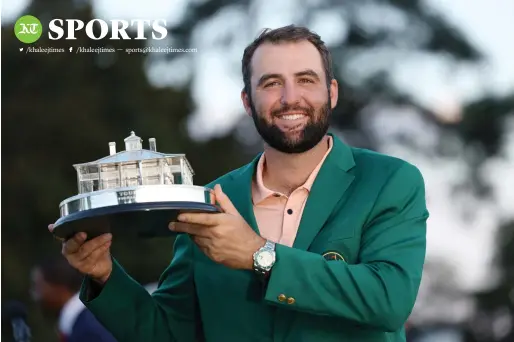  ?? — REUTERS ?? Scottie Scheffler of the US celebrates with his green jacket and the trophy after winning the Masters.