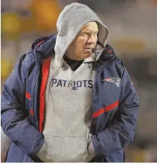  ?? STAFF PHOTO BY NANCY LANE ?? THE BOSS: Bill Belichick prowls the sideline during the Pats’ win Sunday in Pittsburgh.