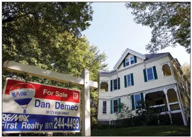  ?? (AP file photo) ?? Mortgage rates for homes like this one in Newton, Mass., fell this week. The average rate on the 30-year fixed-rate home loan fell to 2.67% from 2.71% last week. A year ago, the benchmark rate was 3.73%.