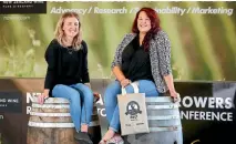  ?? PHOTO: SCOTT HAMMOND/STUFF ?? Amber Silvester, left, and Sarah Szostak, of New Zealand Winegrower­s’ global events team, at the foyer Marlboroug­h Convention Centre on Day 1 of the annual Romeo Bragato conference.