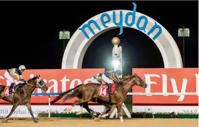  ?? Photo by Leslie Pableo ?? Trinity Force, with Jockey Tadhg O’Shea, wins the Emirates Airline Handicap race at the Meydan Racecourse. —