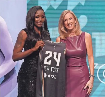  ?? BRAD PENNER/USA TODAY SPORTS ?? Marquesha Davis poses with WNBA commission­er Cathy Engelbert after she is selected with the number eleven overall pick to the New York Liberty in the 2024 WNBA draft on Monday at Brooklyn Academy of Music in Brooklyn, N.Y.