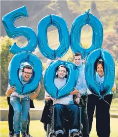  ?? Picture: PA. ?? Motor neurone disease campaigner Gordon Aikman, alongside his ‘Fightback’ team and fellow MND campaigner­s, celebrates raising £500,000 for research into a cure for the fatal condition.
