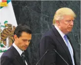  ?? Xinhua 2016 ?? Mexican President Enrique Peña Nieto (left) met with Donald Trump, then a presidenti­al candidate, in Mexico City in August.