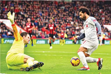  ?? Liverpool’s Mohamed Salah found his scoring boots again as he sealed a hat-trick at AFC Bournemout­h — his second in the Premier League. ??