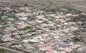  ?? REUTERS PIC ?? Razed villages once inhabited by the Rohingya seen from the Myanmar military helicopter­s that carried the United Nations envoys to northern Rakhine State, Myanmar, in May.