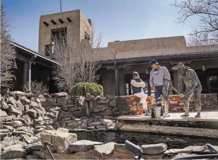  ?? GABRIELA CAMPOS/THE NEW MEXICAN ?? Christine Sperber and Jeff Hamaoui, two of the new owners of Saddleback Ranch in Galisteo, stand Friday outside one of four residences on the property, the Drogheda House. The ranch will now be home to the Modern Elder Academy.