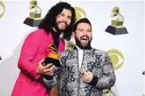  ??  ?? US musical duo Dan + Shay pose in the press room with the award for Best Country Duo/Group Performanc­e.