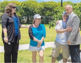  ?? JENNIFER LETT/SUN SENTINEL ?? From left, Parkland Mayor Christine Hunschofsk­y, Lori Alhadeff, Andrew Pollack and Ilan Alhadeff attend a tennis fundraiser and tree dedication ceremony for victims of the shooting at Marjory Stoneman Douglas High on Friday.