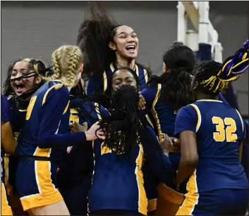  ?? ANDY CROSS — THE DENVER POST ?? The Northfield Nighthawks celebrate their upset victory over the Air Academy Kadets at the Denver Coliseum in Denver on Thursday.