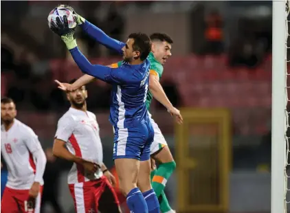  ?? ?? Malta goalkeeper Hanry Bonello blocking the ball in thee early stages of the match. Photo: Domenic Aquilina