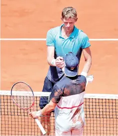  ??  ?? File photo of Argentina’s Diego Schwartzma­n (front) after winning his French Open fourth round match against South Africa’s Kevin Anderson in June. — Reuters photo