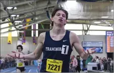  ?? PHOTO BY JIM MAHONEY — MEDIANEWS GROUP/BOSTON HERALD ?? Framingham High’s Sam Burgess paced the field for the win in the 2-mile run to take the title over St. John’s Prep’s Nathan Lopez.