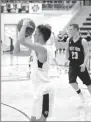  ?? MARK HUMPHREY ENTERPRISE-LEADER ?? Prairie Grove senor Riley Rhodes, shown shooting a 3-pointer in the first half, knocked down the game-winning 3-point shot with seconds to go lifting the Tigers to a thrilling 46-43 win over West Fork on Friday, Dec. 7.