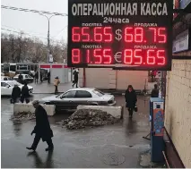  ?? PAV E L G O L O V K I N / T H E A S S O C I AT E D P R E S S F I L E S ?? The Russian central bank’s surprise decision to raise its benchmark rate to 17 per cent from 10.5 per cent on Dec. 16, Black Tuesday, was the biggest rate hike since 1998.