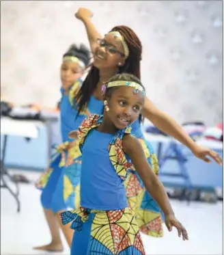  ?? ERIC BONZAR — THE MORNING JOURNAL ?? Six-year-old Aaliyah Gaddie and her fellow African Royalty Dancers perform Dec. 26, for guests of Second Baptist Church’s Kwanzaa celebratio­n in Lorain.