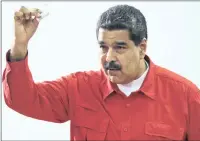  ?? PICTURE: AP ?? Venezuela’s President Nicolas Maduro shows his ballot after casting his vote for a constituti­onal assembly in Caracas on Sunday.