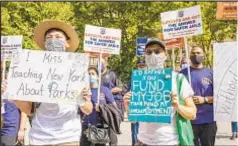  ?? JEFF BACHNER/FOR NEW YORK DAILY NEWS ?? City workers protest against layoffs, but Mayor de Blasio, after announcing furloughs Wednesday, said job cuts are “still on the table.”