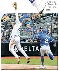  ?? Bill Kostroun ?? MISSED: Pete Alonso is drawn off the bag in one of many defensive blunders by the Mets in their 11-7 loss to the Royals on Saturday.