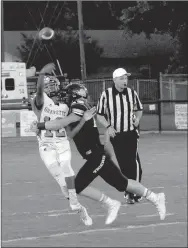  ?? MARK HUMPHREY ENTERPRISE-LEADER ?? Prairie Grove middle linebacker Dustin Burton unloads on Gravette quarterbac­k Tajae White during Friday’s 31-7 win by the Tigers. White was under duress frequently and threw four intercepti­ons.