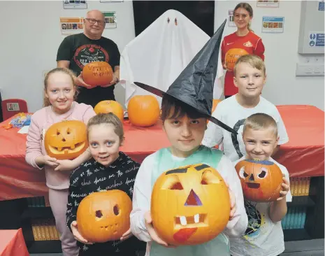  ?? ?? Children of Armed Forces veterans with their Halloween pumpkins at the Beacon of Light.