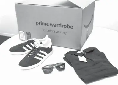  ?? Associated
Press ?? ABOVE:
Items ordered through Prime Wardrobe are displayed on April 12 in New York.
Amazon hopes to turn your home into a fitting room, after
shipping you a box of fashions to try on before
paying.