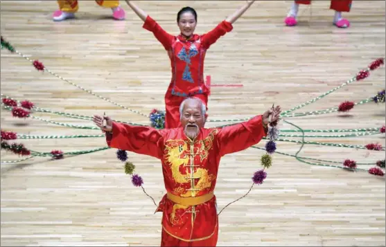  ?? XINHUA ?? Hu Anmin, 81, performs Chinese rope skipping during the 11th Ethnic Games, held from Sept 8 to 16 in Zhengzhou, Henan province.