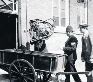  ??  ?? EVIDENCE: The bicycle being unloaded from a police cart and carried into court