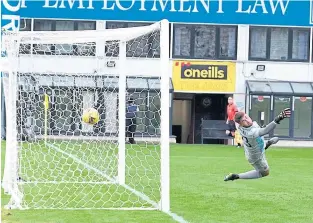  ??  ?? Cove goalkeeper Kyle Gourlay has no chance as Simon Murray scores direct from a free-kick for Queen’s Park