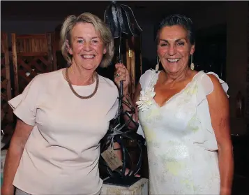  ??  ?? Anna Mai O’Connor (left) receives the lady Captain’s prize of Mary McCauley in Enniscorth­y on Saturday.