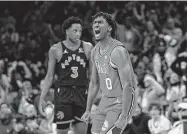  ?? Matt Slocum / Associated Press ?? Philadelph­ia’s Tyrese Maxey, right, had 23 points in the 76ers’ victory over Toronto on Monday.