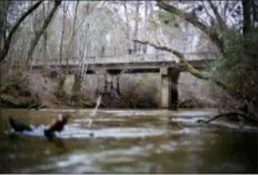  ?? DAVID GOLDMAN — THE ASSOCIATED PRESS FILE ?? This photo shows a bridge that spans the Apalachee River at Moore’s Ford Road where in 1946 two young black couples were stopped by a white mob who dragged them to the riverbank and shot them multiple times in Monroe, Ga. A federal appeals court on Monday upheld a lower court ruling to unseal the transcript­s of the grand jury proceeding­s that followed a months-long investigat­ion into the killings.