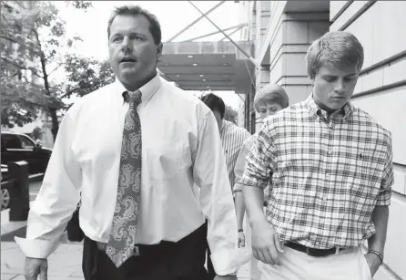  ?? By Manuel Balce Ceneta, AP ?? Waiting game: Roger Clemens, left, leaves court in Washington with his son Kacy on Tuesday after the former pitcher’s perjury case was sent to the jury.