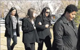  ?? Felicia Fonseca ?? The Associated Press Tanya Romans, right, is followed by family members attending the Jan. 14, 2010, sentencing in St. Johns, Ariz., of a 10-year-old boy who pleaded guilty to negligent homicide in Romans’ husband’s November 2008 killing.