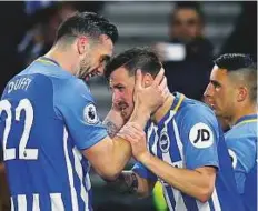  ?? AP ?? Brighton & Hove Albion’s Pascal Gross (centre) celebrates scoring his side’s equaliser from the penalty spot against Tottenham. Brighton are now eight points clear of the relegation zone with just four games to go.