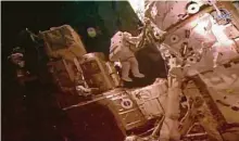  ?? NASA via Associated Press ?? Astronauts Bob Behnken and Chris Cassidy take a spacewalk July 21. NASA says there are about 500,000 pieces of debris to avoid.