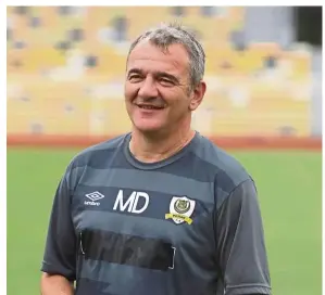  ??  ?? In high spirits: Perak coach Mehmet Durakovic is all smiles after a training session. Perak have not won any matches in the Super League but the man who led them to the Malaysia Cup last season is not worried.