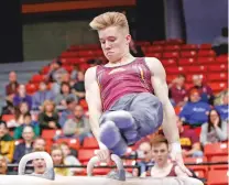  ?? KAMIL KRZACZYNSK­I/ASSOCAITED PRESS FILE PHOTO ?? Minnesota’s Shane Wiskus competes during an NCAA gymnastics meet in Chicago. Wiskus is an Olympic hopeful who moved to the Olympic Training Center in Colorado Springs, Colo., after his college, Minnesota, announced it would be shutting down its gymnastics program.