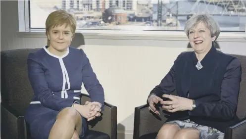  ?? PICTURE: SWNS ?? 0 Nicola Sturgeon in talks on Brexit with Theresa May in Glasgow yesterday