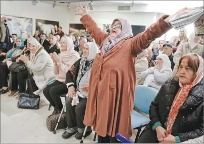  ?? AP PHOTO ?? Bosnian women react upon hearing the sentence at the end of former Bosnian Serb military chief Gen. Ratko Mladic’s trial at the memorial center in Potocari, near Srebrenica, Bosnia, Wednesday.