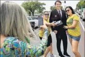  ?? REUTERS ?? Supporters of Brazilian presidenti­al candidate Jair Bolsonaro pose for pictures during a campaign rally in Brasilia.