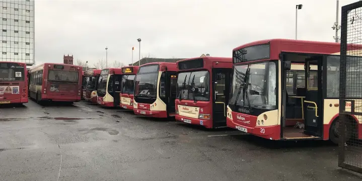  ?? Chris McKeon ?? ● Halton Transport buses parked in the company depot behind Halton Council offices in Widnes on the day the company ceased trading