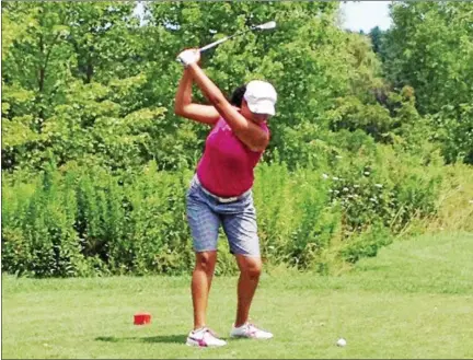  ?? PHOTOS BY MIKE STRIBL — DAILY FREEMAN ?? Amber Pennington takes a practice swing during Sunday’s final round of the Ulster County Women’s Golf Associatio­n championsh­ip at Rondout Golf Club in Accord.