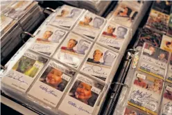 ?? Rashad Sisemore / The Chronicle ?? Signed trading cards are among the wide array of “Star Trek” memorabili­a peddled by vendors at the convention.