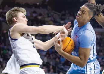  ?? AP ?? North Carolina’s Armando Bacot (right) had a double-double in a win against Notre Dame on Wednesday.