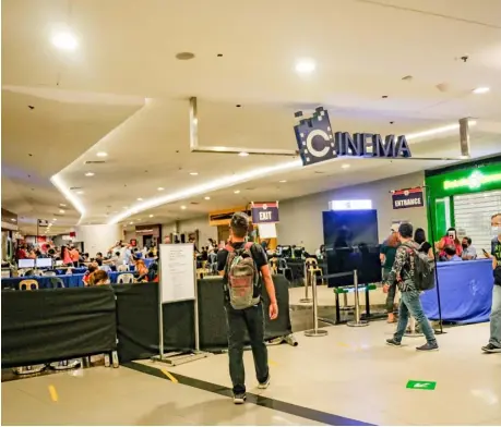  ?? PHOTOGRAPH BY YUMMIE DINGDING FOR THE DAILY TRIBUNE @tribunephl_yumi ?? CINEMAS find temporary use as spaces for government transactio­ns as malls await Malacañang’s decision whether to reopen entertainm­ent venues along with the wider economic activities.