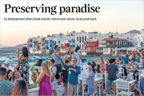  ?? NEW YORK TIMES FILE PHOTO ?? Crowds gather for the sunset in Mykonos, Greece, in 2022. Tourism is crucial in Greece, accounting for one-fifth of the country’s economic output.