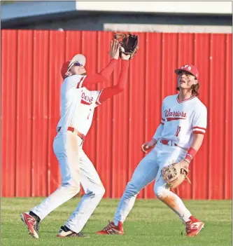  ?? Kelly Shields ?? Gage Kelley catches a fly ball as Devan Hinton looks on. The Warriors picked up the 6-1 home victory over Adairsvill­e last week before closing out the week with an 11-0 victory over the Tigers in the rematch.