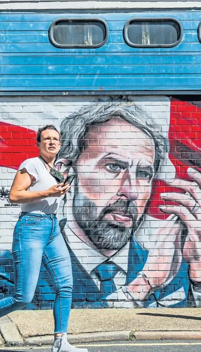  ?? Picture Guy Bell ?? England manager Gareth Southgate, hailed for kindling a different kind of patriotism, and stars Harry Kane and Raheem Sterling on a mural in London after Euros last year